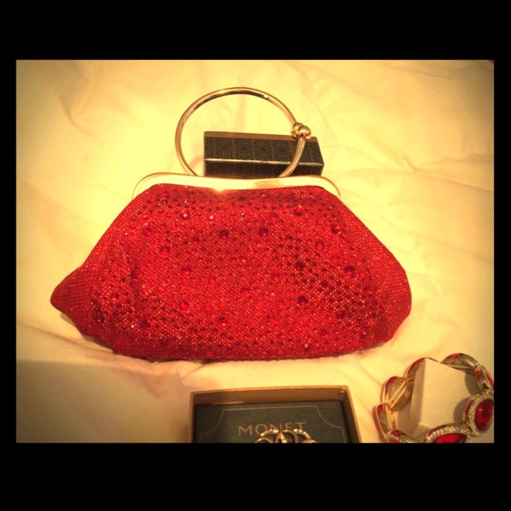 Red and gold party purse clutch with accessories.